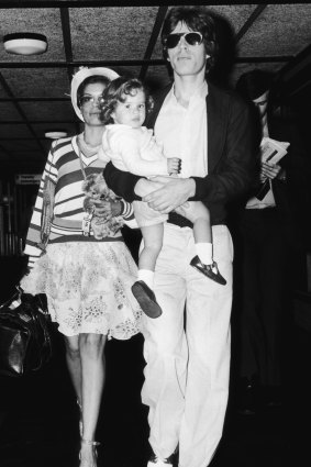 Rock star Mick Jagger with his wife Bianca and their daughter Jade, circa 1974.