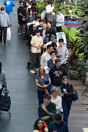 People queue to vote in Docklands.