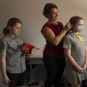 Holly Usher and her children, Claire and Nathan at home.