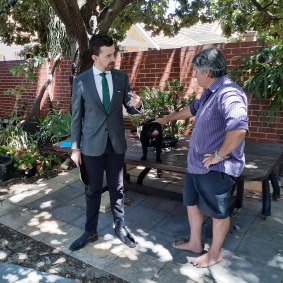 Zak Kirkup in Mount Lawley with a voter and a pug.