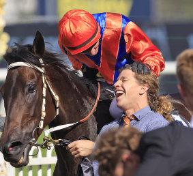 Glen Boss celebrates with strapper Nathan Kynes after the George Ryder Stakes
