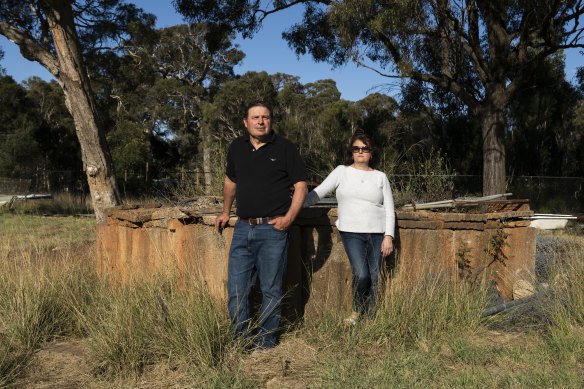 Sam and Therese Grima on their Orchard Hill block on Tuesday, with their trees in the background. 