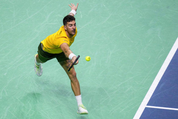 Australia’s Thanasi Kokkinakis returns the ball against Italy’s Matteo Berrettini.