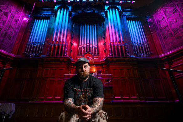 David Cohen, aka Sow Discord, with the organ at the Melbourne Town Hall: “The bass tones on it are incredible.”