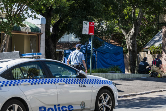 Emergency services remain at the scene after a boy was hit by a car in Glebe on Friday morning