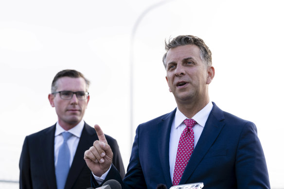 NSW Minister for Transport and Roads Andrew Constance (right), flanked by Treasurer Dominic Perrottet.