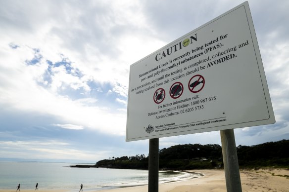 Contamination warning signs around Wreck Bay.