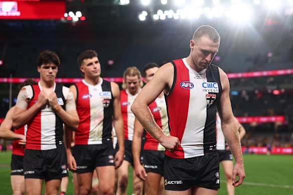 Callum Wilkie of the Saints leads the team off the field.