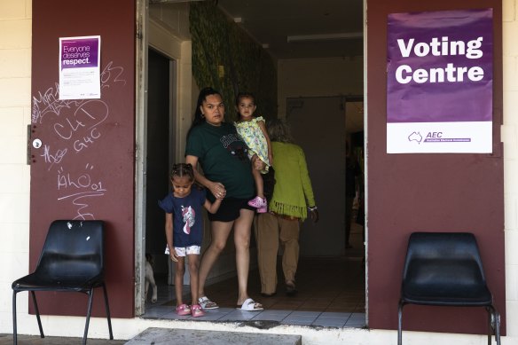 Takani Warner with her daughters at the Cherbourg polling centre on Saturday.