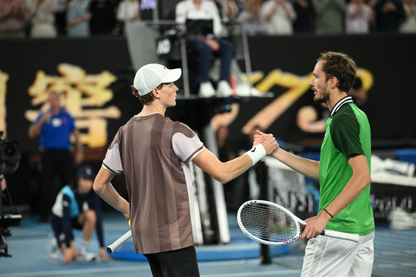 Jannik Sinner and Daniil Medvedev shake hands post match.