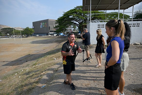 Bronte Gildea (blue) on a media tour in Port Moresby with Chiefs head of pathways, Joey Grima.