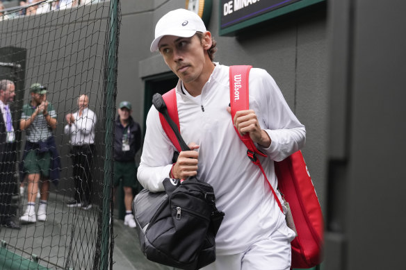 Alex de Minaur walks out on court.