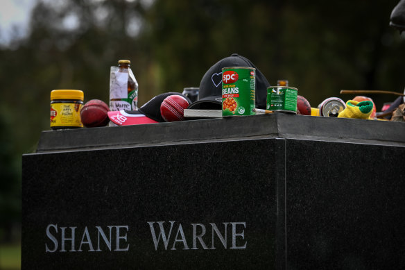 Tributes at Warne’s statue included Vegemite, baked beans and a half-smoked cigarette.