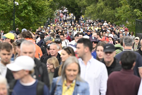 People stretch as far as the eye can see on the walk to the MCG.