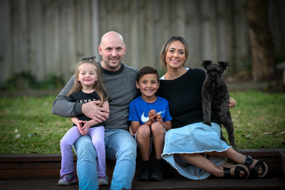 Xavier Mellor with his parents, Nathan and Ebony, and his three-year-old sister, Skylah, and dog Minnie.