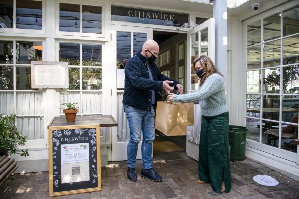 Chef and restaurateur Matt Moran hands Weldon lunch prepared by the team at his Chiswick restaurant.