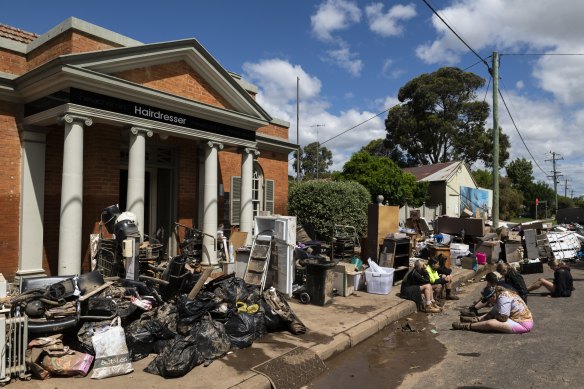 The cleanup begins in Eugowra after flash flooding destroyed the town on Monday.