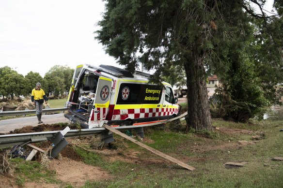 An ambulance is seen amid flood debris in Eugowra.