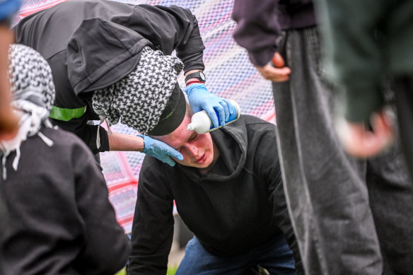 A protester being treated after being pepper sprayed.