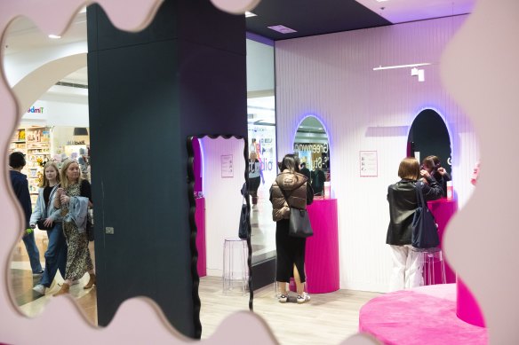 Shoppers using the Dyson Airwraps at Greenwood Plaza’s “self-style studio”.