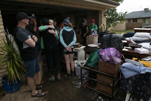 A family embraces in Eugowra on Tuesday.