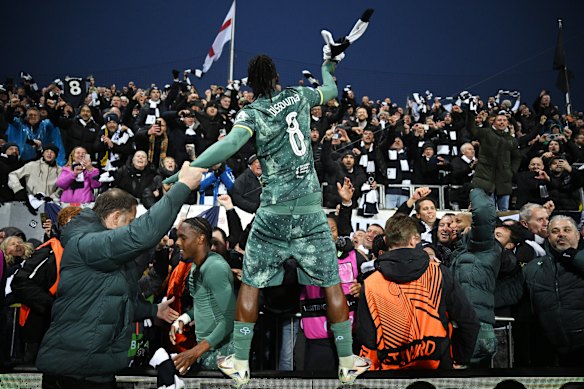 Yves Bissouma leads the post-match celebrations.