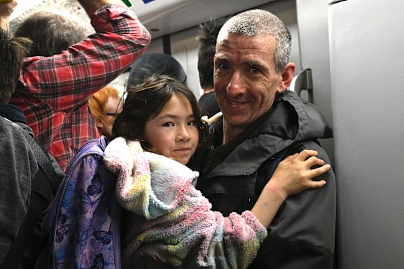 Train enthusiasts Ryan Bilszta and his daughter Hannah from Pascoe Vale were among the first passengers to ride the train through the new Metro Tunnel.