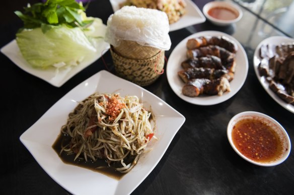 The spread: paw paw salad, sticky rice, Lao sausage, ox tongue and crispy fried rice.