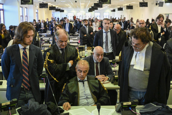 Officials listen as judges read the verdicts of a maxi-trial of hundreds of people accused of membership in Italy’s ’Ndrangheta organised crime syndicate.