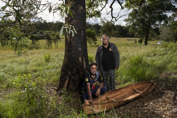 Uncle John Kelly and Uncle Harry Ritchie with the canoe made as part of the community project.