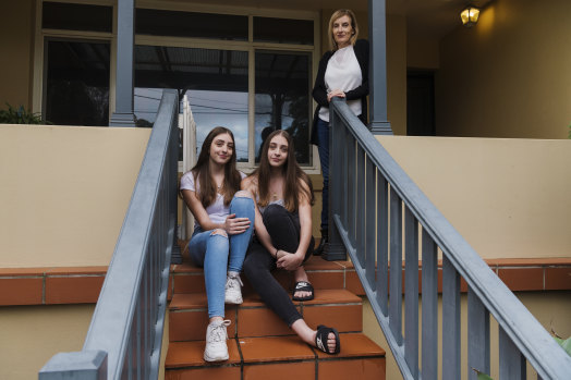Twins Madelyn (blue jeans) and Lara, with mum Sonia Tecli at their home in Gladesville. 