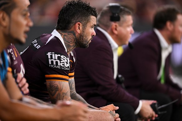 Adam Reynolds watches on from the sidelines after leaving the field in the Brisbane Broncos’ win against Wests Tigers.