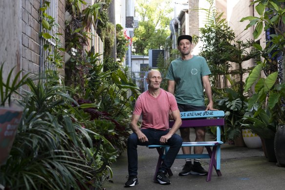 Sebastian Vasquez and Mike Heenan say the once-dingy laneway behind their Darlinghurst home has cooled, and is frequented by birds, bees and geckos, after they filled it with plants.