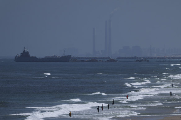 A ship is seen off the coast of Gaza near the US-built floating pier.