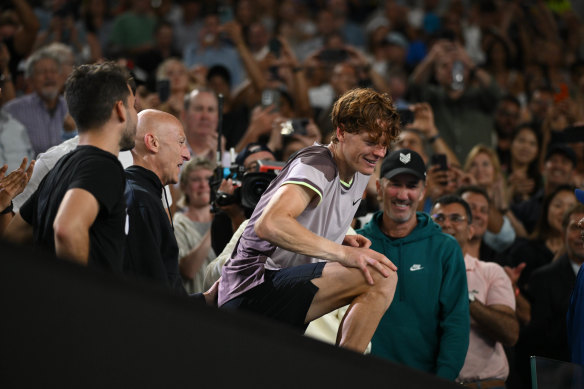 Jannik Sinner celebrates with his team.