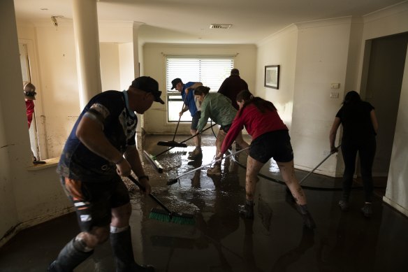 Locals look to recover following flash flooding in Eugowra on Monday. 