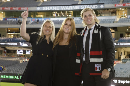 Brooke, Summer and Jackson Warne in front of the newly named Shane Warne Stand at the MCG.