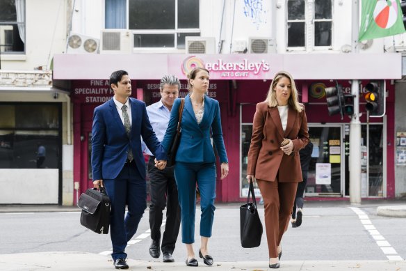 Hannah Quinn (blue suit) arrives at court with her solicitor Lauren MacDougall (right) in 2020.