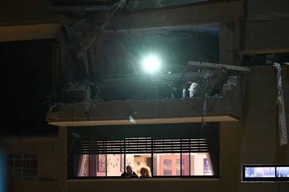 Damage from a ballistic missile attack  in Tel Aviv, Israel, is seen at a building in which a couple in their 70s were killed.