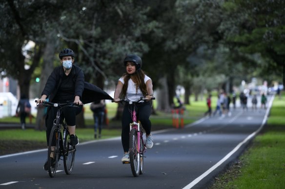 People cycling in Centennial Park.