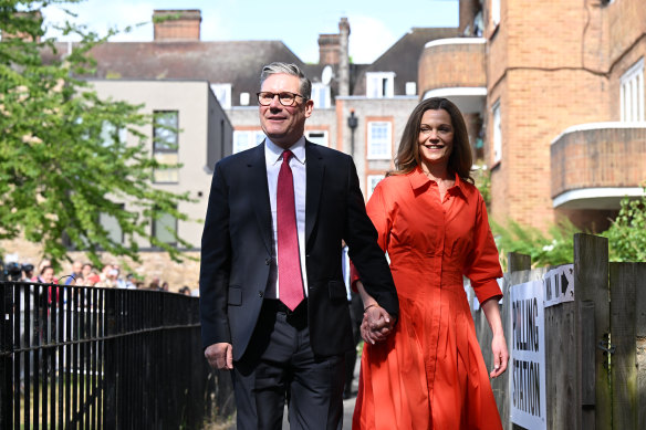 Labour Party leader Keir Starmer and his wife Victoria arrive to cast their votes at a booth in London.