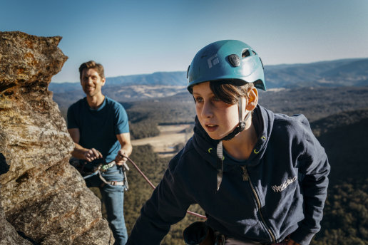 David Ralphs rock climbs with his son Jack, 12, at Medlow Bath near their home in the Blue Mountains.