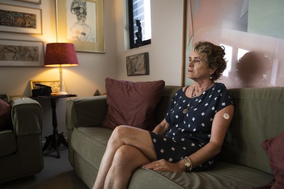 Amanda Bilson, widow of restaurateur Tony Bilson, in her Zetland home. A John Olsen portrait of her late husband is in the corner near the window.