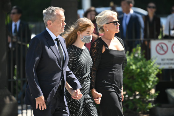 Former leader of the Opposition Bill Shorten, wife Chloe Shorten and daughter Clementine arrive ahead of the funeral service.