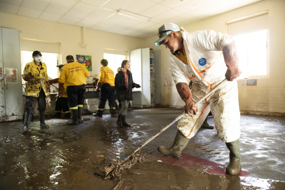 The clean-up begins at St Joseph’s Primary School in Eugowra on Wednesday. 
