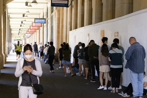 People  queue outside the Central Station COVID-19 testing clinic in Sydney on December 31.
