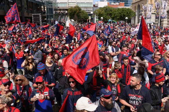 Fans show their strong support for the Demons at ‘Footy Place’ in Perth.