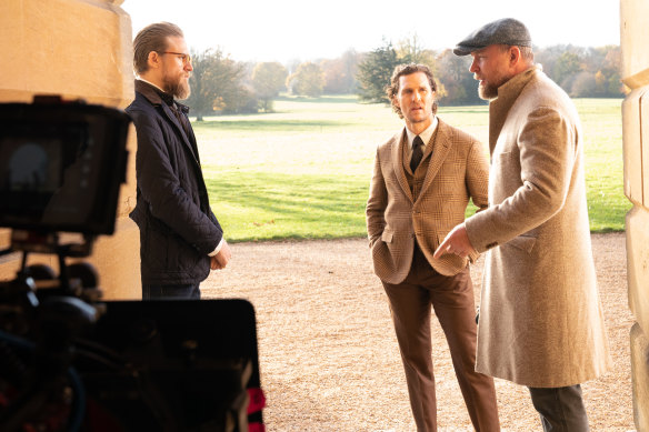 Guy Ritchie on the set of The Gentlemen with Charlie Hunnam, left, and Matthew McConaughey.