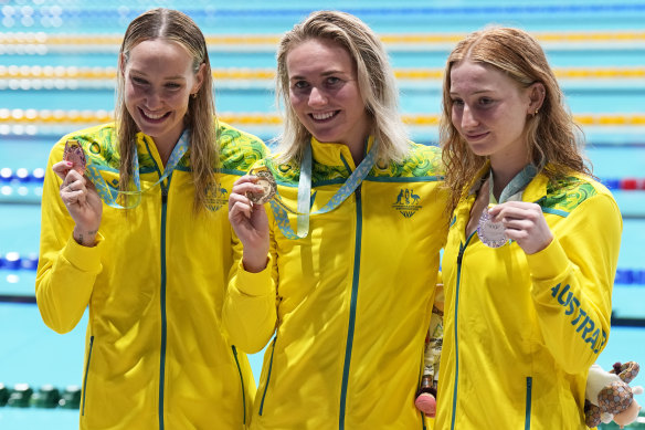 Australians Madison Wilson, Ariarne Titmus and Mollie O’Callaghan with their bronze, gold and silver medals after the Women’s 200 meters freestyle final.