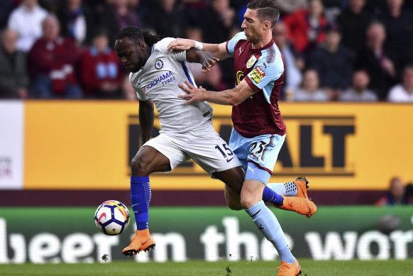 Chelsea's Victor Moses (left) battles with Burnley's Stephen Ward.